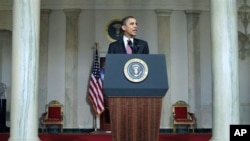 President Barack Obama makes a statement on the resignation of Egypt's President Hosni Mubarak in the Grand Foyer at the White House in Washington, February 11, 2011