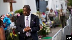 Church member Thomas Rose leaves a wake for Sen. Clementa Pinckney, one of the nine killed in last week's shooting at Emanuel AME Church, June 25, 2015, in Charleston. 