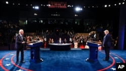 President Donald Trump and Democratic presidential candidate former Vice President Joe Biden participate in the final presidential debate at Belmont University, Oct. 22, 2020, in Nashville, Tenn.