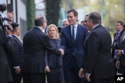 Homeland Security Secretary Kirstjen Nielsen, from center left, White House Senior Adviser Jared Kushner, Treasury Secretary Steven Mnuchin and Secretary of State Mike Pompeo, are received at Los Pinos presidential residence by Carlos Sada Solana, Mexico's undersecretary for North America, in Mexico City, July 13, 2018.