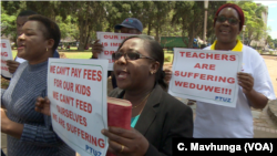 Teachers demanding to be paid in U.S. dollars take to the streets in Harare, Zimbabwe, Nov. 9, 2018. 