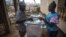 A voter casts his ballot at a polling station in Freetown, Sierra Leone, March 7, 2018. (Photo: Jason Patinkin / VOA) 