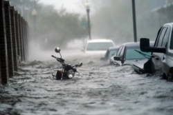 Floodwaters move on the street, Sept. 16, 2020, in Pensacola, Fla. Hurricane Sally made landfall Wednesday near Gulf Shores, Alabama, as a Category 2 storm.