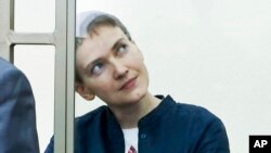 FILE - Nadezhda Savchenko sits in a glass cage in a town of Donetsk, Rostov-on-Don region, March 21, 2016. 