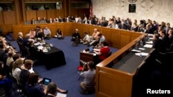 (2nd L table, L - R) U.S. Defense Secretary Chuck Hagel, Secretary of State John Kerry and Gen. Martin E. Dempsey, chairman of the Joint Chiefs of Staff, present administration's case for military action against Syria to a Senate Foreign Relation Committee hearing in Washington, Sept. 3, 2013. 