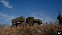 FILE - A truck equipped with a Grad rocket launch system is seen outside Donetsk, eastern Ukraine, Feb. 27, 2015.