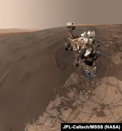 This self-portrait of NASA's Curiosity Mars rover shows the vehicle at "Namib Dune," where the rover's activities included scuffing into the dune with a wheel and scooping samples of sand for laboratory analysis.