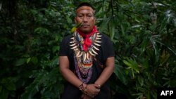 FILE - Alex Lucitante, of the indigenous Cofan ethnic group, poses for a picture at Avie village, in Lago Agrio, Sucumbíos Province, Amazon region, Ecuador, on January 15, 2023.