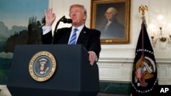 President Donald Trump speaks about his trip to Asia in the Diplomatic Reception Room of the White House, Nov. 15, 2017, in Washington.