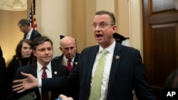 House Judiciary Committee ranking member Rep. Doug Collins, R-Ga., speaks with reporters about the end of a House Judiciary Committee markup of the articles of impeachment against President Donald Trump, on Capitol Hill, Dec. 12, 2019, in Washington. 
