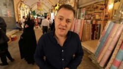 BBC correspondent Martin Patience reports from an Iranian bazaar in a screenshot of a BBC News TV report published on YouTube.