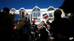 People demonstrate outside the Pennsylvania Convention Center where votes are being counted, Nov. 6, 2020, in Philadelphia.