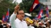 FILE - Sam Rainsy (C), leader of the opposition Cambodia National Rescue Party is seen speaking at a protest in central Phnom Penh.
