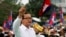 FILE - Sam Rainsy (C), leader of the opposition Cambodia National Rescue Party is seen speaking at a protest in central Phnom Penh.
