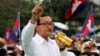 FILE - Sam Rainsy, shown at a Phnom Penh rally in 2013, says his Cambodian National Rescue Party would support Hang Puthea as the ninth, neutral member of the National Election Committee.