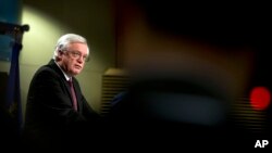 British Secretary of State for Exiting the European Union David Davis speaks during a media conference at EU headquarters in Brussels, March 19, 2018. 