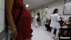 A pregnant woman waits for a routine general checkup, which includes Zika screening, at the maternity ward of the Hospital Escuela in Tegucigalpa, Honduras, Jan. 27, 2016. 