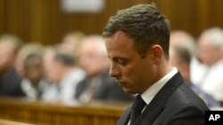 FILE - Oscar Pistorius sits in court, after sentencing.