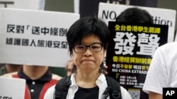Taiwanese people gather to support Hong Kong people as the administration prepares to open debate on a highly controversial extradition law, in front of Hong Kong Economic, Trade and Culture Office in Taipei, Taiwan, June 12, 2019.