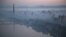 Dawn breaks over Pyongyang, North Korea, as buildings poke through the midst and the Juche Tower, left, stands by the Taedong riverbank, Oct. 13, 2015.