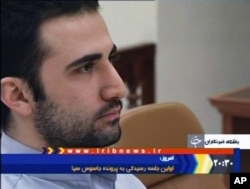 FILE - In this video frame grab image made from the Iranian broadcaster IRIB TV, U.S. citizen Amir Mirzaei Hekmati, accused by Iran of spying for the CIA, sits in Tehran's revolutionary court, in Iran, Dec. 27, 2011.