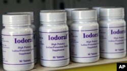 Bottles of potassium iodide sit on the shelf of the Texas Star Pharmacy in Plano, Texas, March 15, 2011