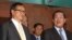 FILE PHOTO - Cambodian Prime Minister Hun Sen, right, talks with the main Opposition Party leader Sam Rainsy, left, of Cambodia National Rescue Party, after their meeting in Senate headquarters in Phnom Penh, Cambodia, Tuesday, July 22, 2012. (AP Photo/Heng Sinith)