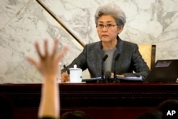 Fu Ying, spokeswoman for the National People's Congress, waits for questions from journalists during a press conference in the Great Hall of the People in Beijing, March 4, 2015.