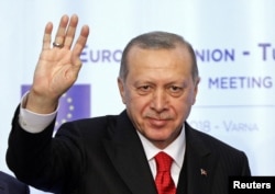 FILE - Turkish President Tayyip Erdogan waves during a news conference at Euxinograd residence, near Varna, Bulgaria, March 26, 2018.
