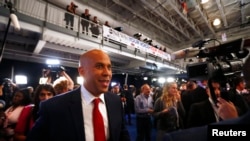 Senator Cory Booker works his way through the spin room after the 2020 Democratic U.S. presidential debate in Houston, Sept. 12, 2019. 