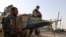 Soldados del Ejército Nacional Afgano vigilan el puesto de control en el distrito de Guzara de la provincia de Herat, el viernes 9 de julio de 2021.