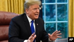 FILE - President Donald Trump speaks during a meeting in the Oval Office of the White House in Washington, Feb. 22, 2019.
