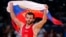 Russia's Dzhamal Otarsultanov celebrates after defeating Georgia's Vladimer Khinchegashvili on the final of the Men's 55Kg Freestyle wrestling during the London 2012 Olympic Games Aug. 10, 2012.