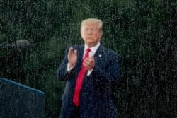 President Donald Trump applauds during an Independence Day celebration in front of the Lincoln Memorial, July 4, 2019, in Washington.