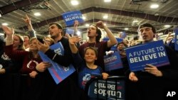 Supporters cheer as Democratic presidential candidate, Sen. Bernie Sanders, I-Vt., arrives during a rally on March 11, 2016 in Summit, Ill.