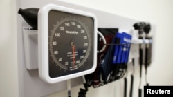 FILE - Medical equipment on the wall of an examination room in San Diego, Calif., Nov. 17, 2014.
