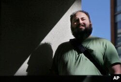 FILE - Software engineer Laurence Berland poses for a photo in San Francisco, California, March 7, 2017.