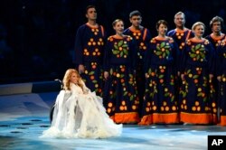 FILE - Yulia Samoylova appears on stage during the opening ceremony of the 2014 Paralympic Games in Sochi, Russia, March 7, 2014.