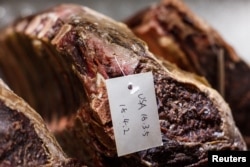 FILE - Beef imported from the U.S. is seen at Wolfgang's, a high-end steak house in East Beijing's Sanlitun district, China, April 6, 2018. China says meat products are among the U.S. good to be affected July 6 by tariffs.