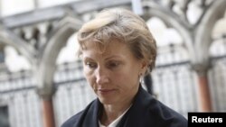 FILE - Marina Litvinenko, the widow of murdered KGB agent Alexander Litvinenko, leaves the High Court in central London, July 28, 2015.