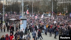 Belarusian opposition supporters walk during a rally to reject the presidential election results in Minsk, Belarus, Nov. 1, 2020. 