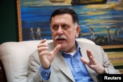 FILE PHOTO: Prime Minister of Libya's unity government Fayez Seraj speaks during an interview with Reuters at his office in the naval base of Tripoli, Libya, June 3, 2016.