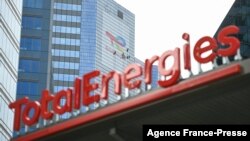 FILE - This May 28, 2021, photo shows the new TotalEnergies logo during its unveiling ceremony, at a charging station in La Defense on the outskirts of Paris.