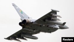 FILE - A British Eurofighter EF-2000 Typhoon takes off from Gioia del Colle NATO airbase in southern Italy.