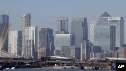 FILE - London's financial district in Canary Wharf, London, March 25, 2020. 