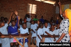 Sarah Sanyu, the headmistress at Parents Care Infant Academy, carries out a menstruation class in the upper primary school in Makindye-Kampala Uganda.