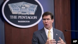 FILE - U.S. Secretary of Defense Mark Esper speaks to reporters during a briefing at the Pentagon, Aug. 28, 2019. 