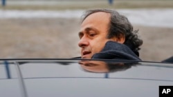 FILE - UEFA President Michel Platini is seen getting into a car in a Jan. 19, 2015, photo.