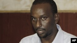 FILE - Zakariya Ismail Hersi, once a senior al-Shabab commander, says the group's ties with al-Qaida have broken. He's shown at a press conference in Mogadishu, Somalia, Jan. 27, 2015. 