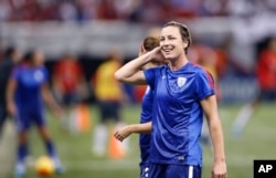 FILE - United States forward Abby Wambach reacts before an international friendly soccer (football) match against China in New Orleans, Dec. 16, 2015. Wambach retired from international competition after the game.